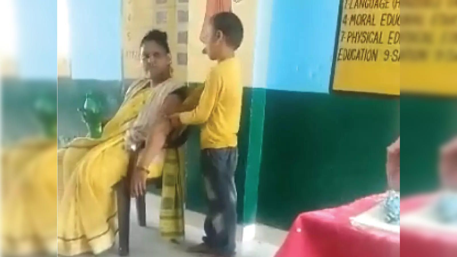 Teacher Andstudentgirl Xnxx - Teacher Massage: Teacher gets student to massage her arm, is suspended:  Viral video - The Economic Times