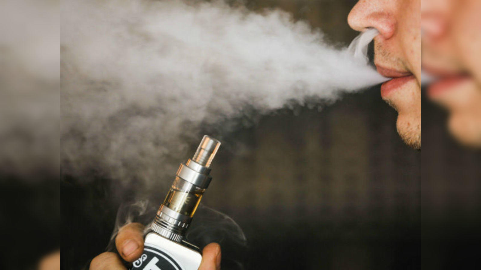 E cigarette vapour can kill lung cells Scientist The Economic Times