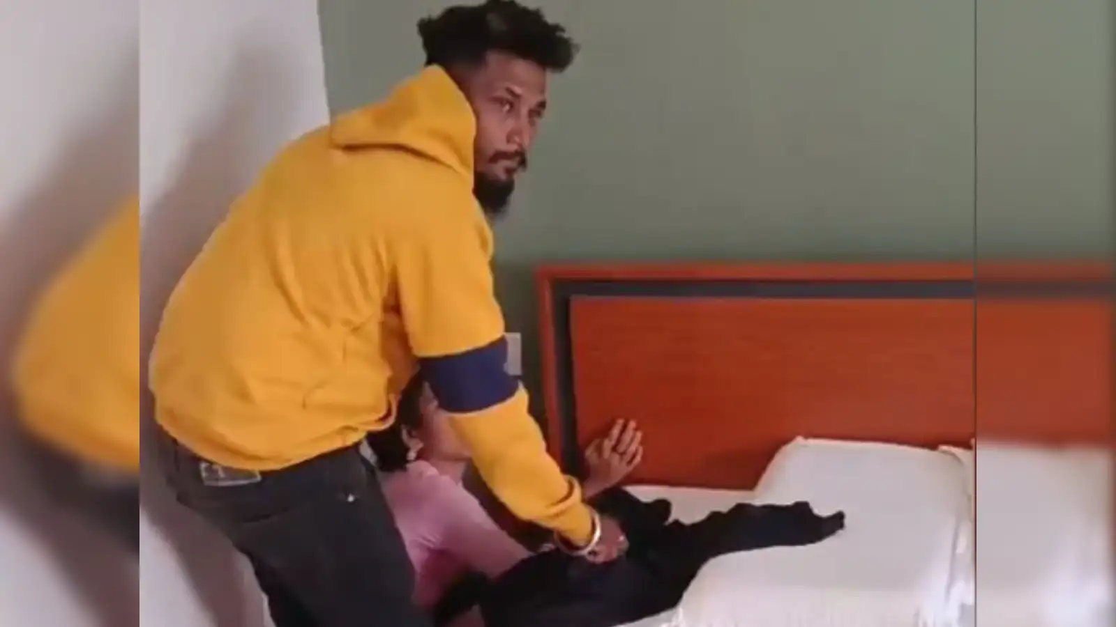 Karnataka: Viral Video: Karnataka interfaith couple brutally attacked in  hotel room by 6 men - The Economic Times