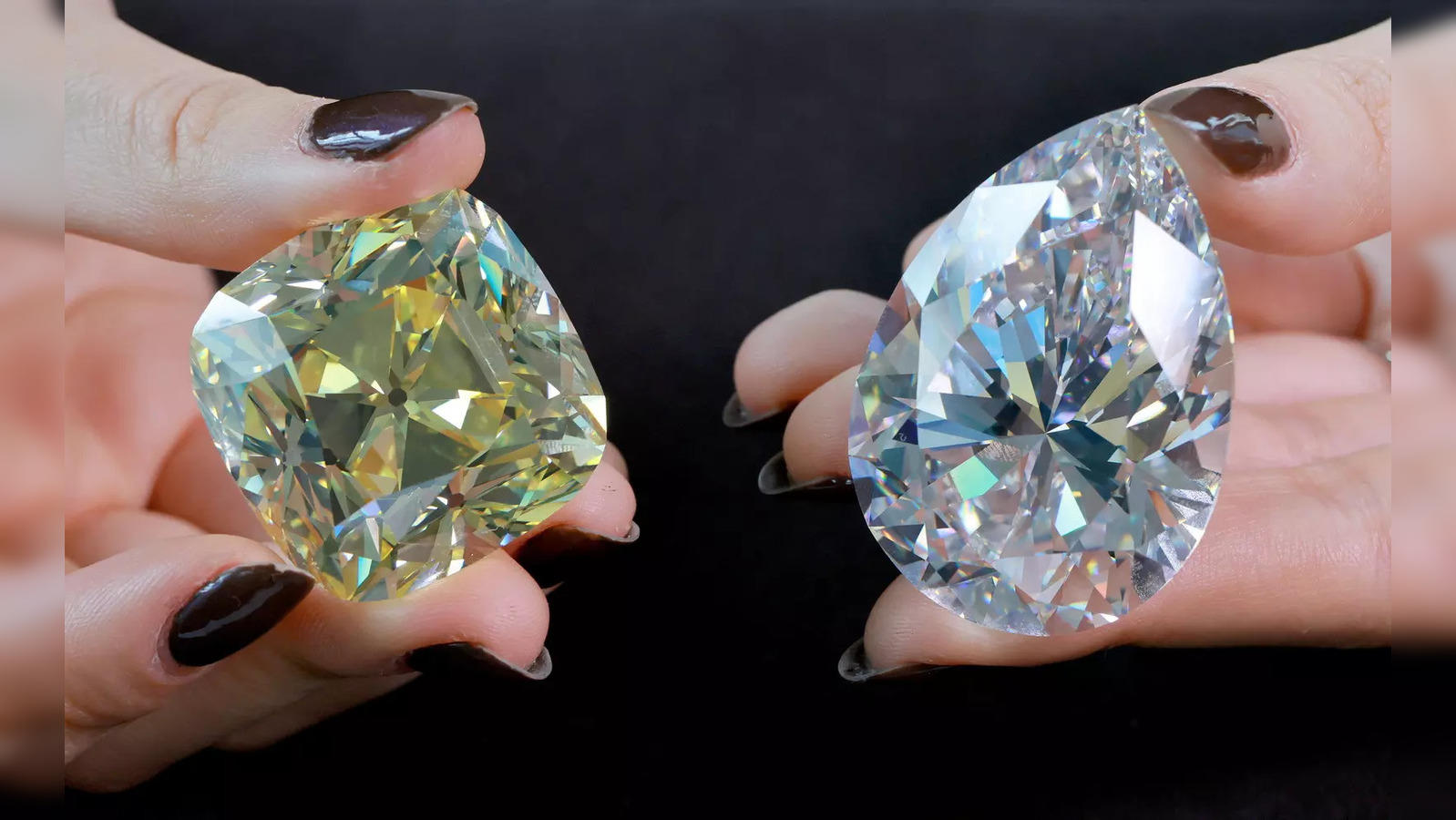 228 carat egg sized diamond fetches over 21 mn 205 carat yellow stone sells for more than 14 mn at geneva auction