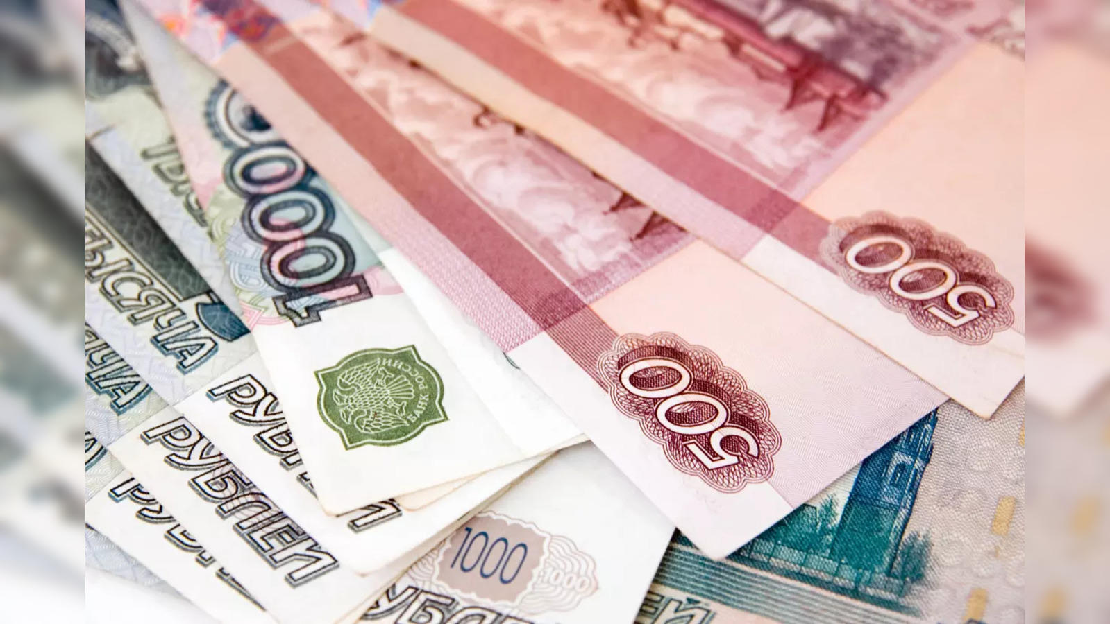 gmt Russians feel the pinch as rouble tumbles past 91 vs dollar