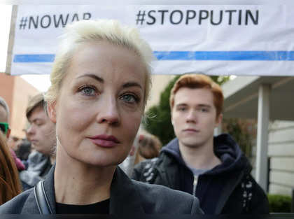 Russians crowd polling stations in apparent protest as Vladimir Putin is set to extend his rule