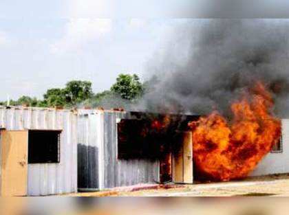 Locals burn six containers being used as Posco camp office