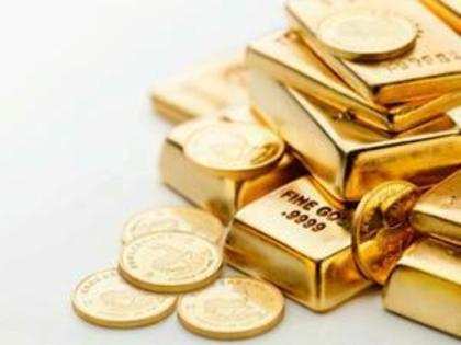 Gold futures drop below 30k level on global cues