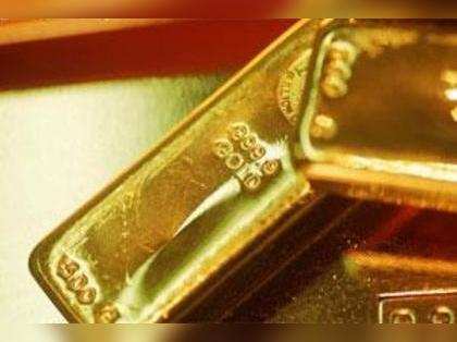 Gold futures drop Rs 136 on weak global cues, profit-booking