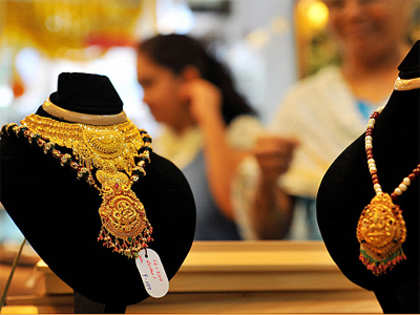 Gold drops on poor demand; silver ends steady