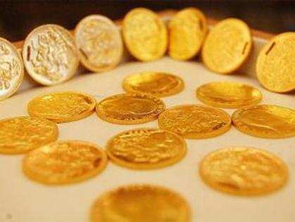 Gold falls on global cues, muted demand