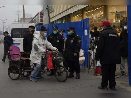 China's Covid 19 cases touch record high; Beijing resorts to community lockdowns