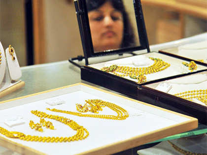 Gold futures down 0.55 per cent on weak global cues