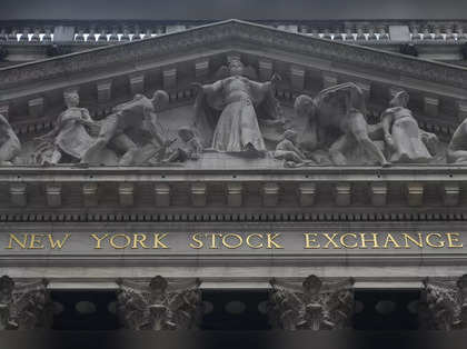 US stocks rise after strong GDP data; Tesla drops to 8-month low