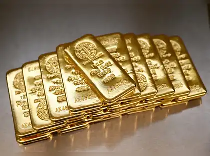 Investor looking at gold charts, depicting market analysis and investment decisions.