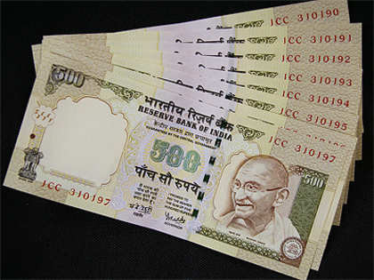 Rupee pares initial gains, still up by 20 paisa vs US dollar