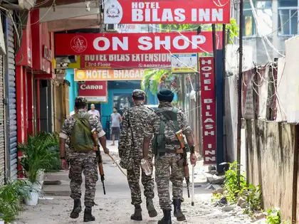 Security personnel keep vigil at the site after at least six people were allegedly shot dead at Hotel Bilas Inn following a dispute between the owner of the property and its leaseholder, in Guwahati, Assam