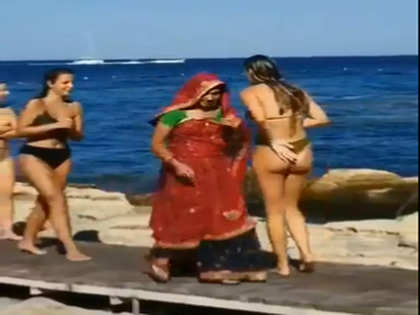 Happy woman taking bikini top off on bea, Stock Video