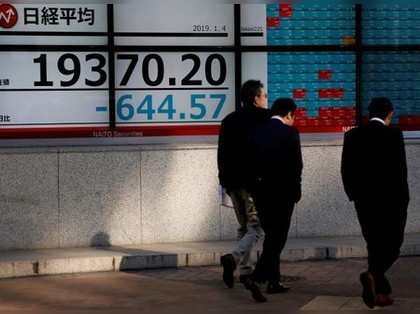 Nikkei gains on strong Wall Street; Olympus jumps
