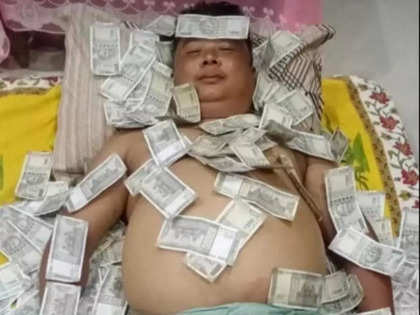 BJP ally UPPL leader seen lying on bed filled with Rs 500 notes in a viral photo