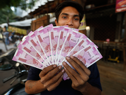 Top analyst says keep buying rupee after best Budget-day gain in 7 yrs