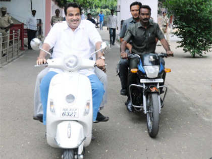 Nitin Gadkari courts controversy by riding scooter without helmet