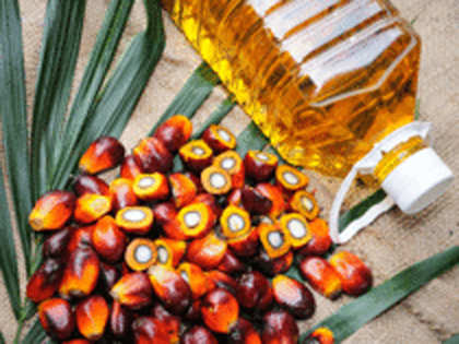 Palm oil tracks drop in soyoil, lower output hopes limit fall