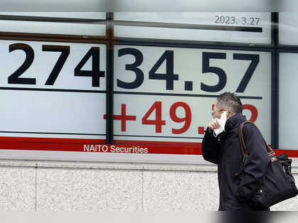 Japan shares end higher as bank stocks rise amid easing financial crisis fears