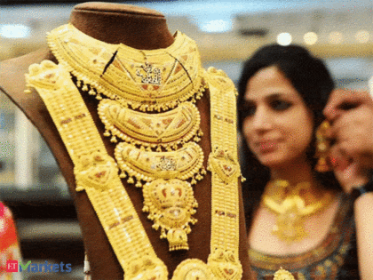 Gold Price Today: Yellow metal futures fall by Rs 80/10 gram in opening trade. Should you buy or sell?