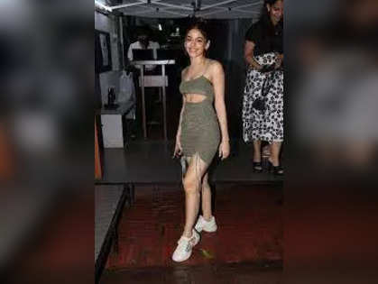 Alaya F turns heads with plunging neckline olive green dress