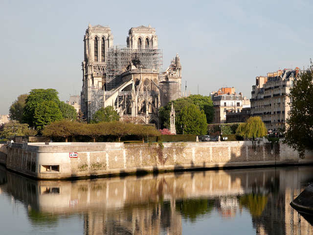 Notre Dame fire: Louis Vuitton and Gucci owners donate £260m to rebuild  cathedral, World, News