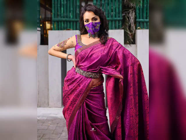 Belt your saree, adorn a crop top, change tradition