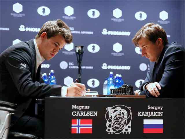 World Chess Champion Magnus Carlsen begins match with black against Anish  Giri in UN-backed campaign targeting racial discrimination-Sports News ,  Firstpost