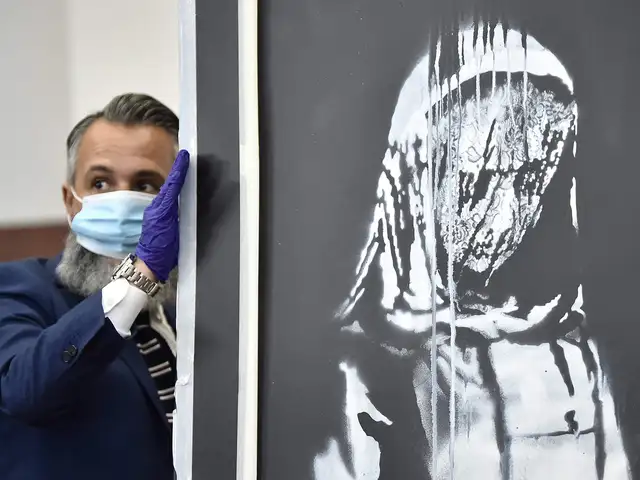 Banksy Bataclan Victims Painting Stolen From Paris Banksy Artwork Honouring Bataclan Victims Makes Its Way To Italy The Economic Times