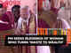 PM bows, touches feet of lady who turns 'waste to wealth'